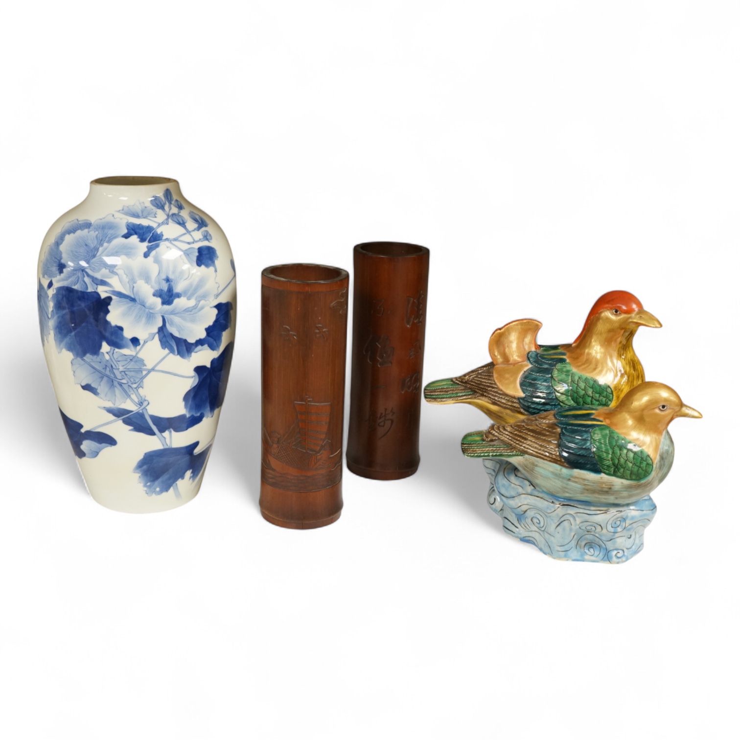 A Chinese Revolution Period porcelain bird group, 21.5cm, a pair of Chinese bamboo brushpots carved with figures and junks, each 22cm high, and a Japanese Seto blue and white vase, 29cm high